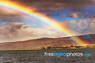 Rainbow Along Shoreline On Kauai Island Of Hawaii Stock Photo