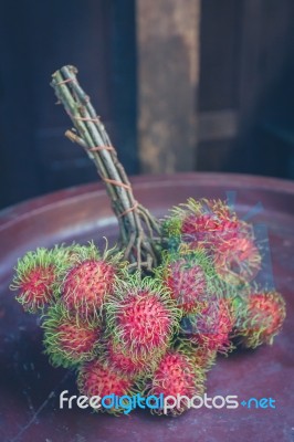 Rambutan On Wood Stock Photo