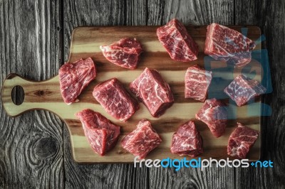 Raw Angus Beef Slices On The Old Wooden Table Horizontal Stock Photo