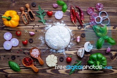 Raw Dough With Ingredients For Homemade Pizza On Shabby Wooden B… Stock Photo