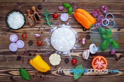 Raw Dough With Ingredients For Homemade Pizza On Shabby Wooden B… Stock Photo