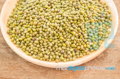 Raw Green Bean In Wooden Plate Stock Photo