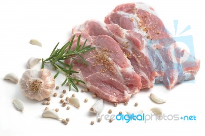 Raw Pork Meat Steaks With Spices On The White Background Stock Photo