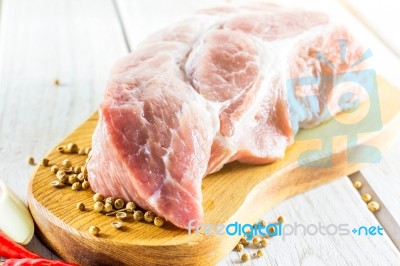 Raw Pork Tenderloin On A Cutting Board Ready To Cook Stock Photo