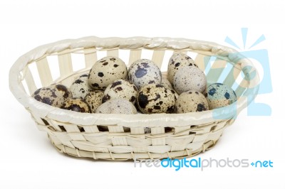 Raw Quail Eggs Inside A Wicker Basket Stock Photo