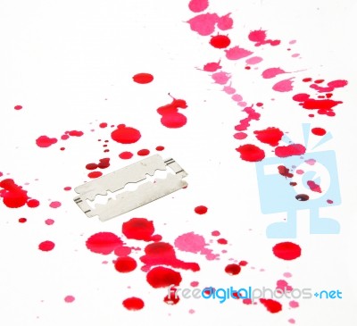 Razor Blade With Drop Of Blood Stock Photo