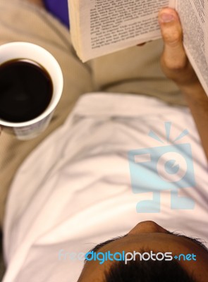 Reading Book And Drinking Coffee Stock Photo