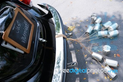 Rear View Of A Vintage Car With Just Married Sign And Cans Attached Stock Photo