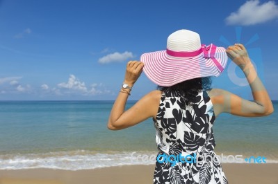 Rear View Of Beautiful Brunette Woman Happy And Enjoy Tropical Beach Stock Photo