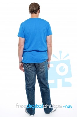 Rear View Of Casual Young Guy Posing Stock Photo