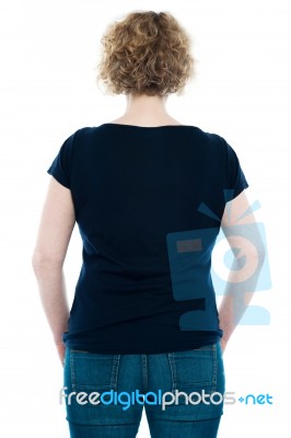 Rear View Of Curly Haired Woman Stock Photo