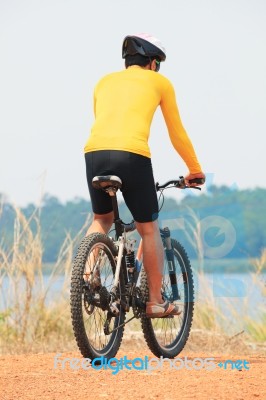 Rear View Of Young Bicycle Man Wearing Rider Suit And Safety Hel… Stock Photo