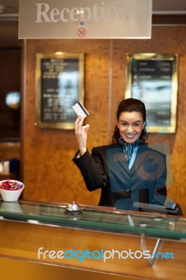 Receptionist Holding Cash Card Stock Photo