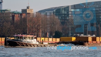 Reclaim Pulling Containers Down The River Thames Stock Photo