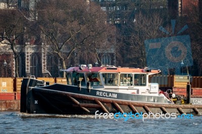 Reclaim Pulling Containers Down The River Thames Stock Photo