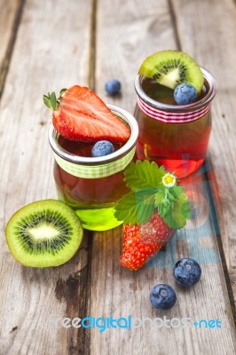 Red And Green Jelly Served With Fruit Stock Photo