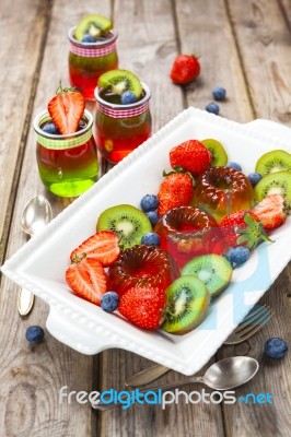 Red And Green Jelly Served With Fruit Stock Photo