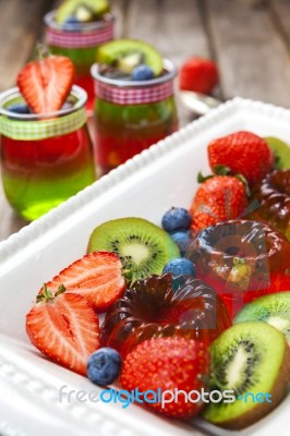 Red And Green Jelly Served With Fruit Stock Photo