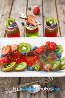 Red And Green Jelly Served With Fruit Stock Photo