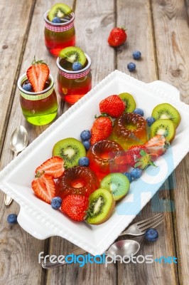 Red And Green Jelly Served With Fruit Stock Photo