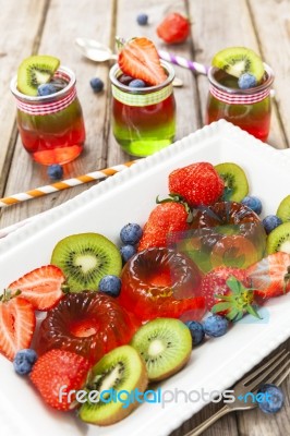 Red And Green Jelly Served With Fruit Stock Photo