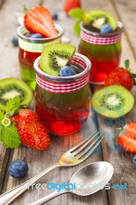 Red And Green Jelly Served With Fruit Stock Photo