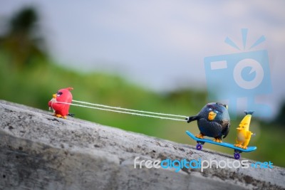 Red Angry Bird Pull His Friends Up The Hill With A Rope Attached… Stock Photo