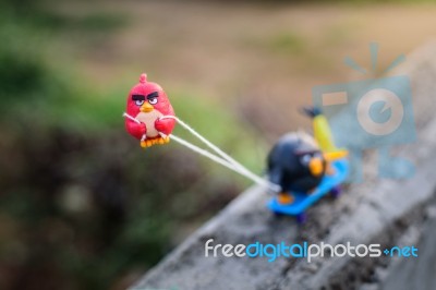 Red Angry Bird Pull His Friends Up The Hill With A Rope Attached… Stock Photo