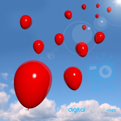 Red Balloons flying In The Sky Stock Image