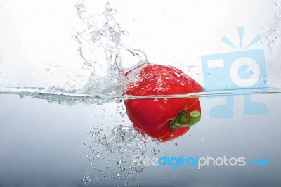 Red Bell Pepper Splashing Stock Photo