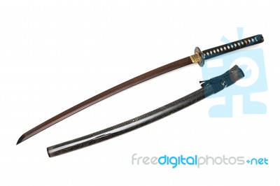 Red Blade Japanese Sword  Black Cord With  Shiny Ray Skin Wrapped Scabbard  Isolated In White Background Stock Photo