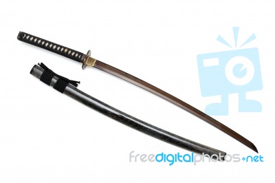 Red Blade Japanese Sword  Black Cord With  Shiny Ray Skin Wrapped Scabbard  Isolated In White Background Stock Photo