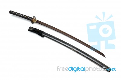 Red Blade Japanese Sword  Black Cord With  Shiny Ray Skin Wrapped Scabbard  Isolated In White Background Stock Photo