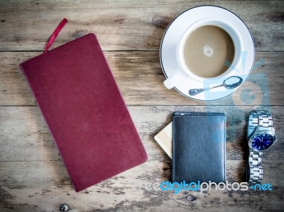 Red Book With A Purse And Credit Cards On A Wooden Background Stock Photo