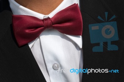 Red Bow Tie On White Shirt Stock Photo