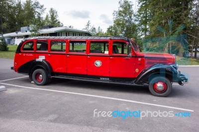 Red Bus In Glacier National Park Montana Stock Photo