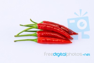 Red Chili Pepper On A White Background Stock Photo