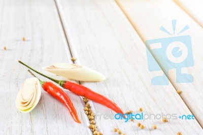 Red Chillies Pepper On The White Wooden Floor Stock Photo