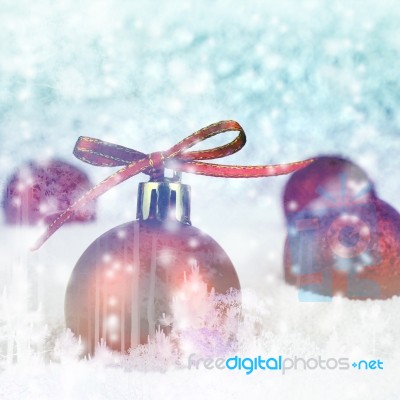 Red Christmas Ball With Bokeh In Blue Moontone Tone Stock Photo