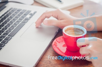 Red Coffee Cup With Notepad And Laptop Stock Photo