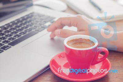 Red Coffee Cup With Notepad And Laptop Stock Photo