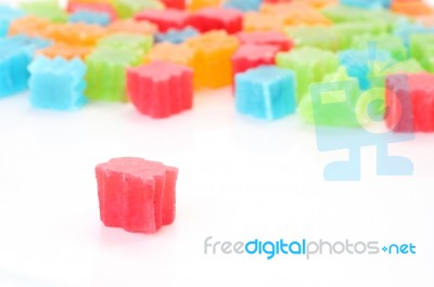 Red Color Crispy Jelly In Front Of Pile Stock Photo