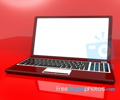 Red Computer On Desk With White Copyspace Stock Image