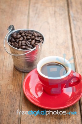 Red Cup Of Espresso On Wooden Table Stock Photo