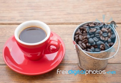 Red Cup Of Espresso On Wooden Table Stock Photo