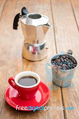 Red Cup Of Espresso On Wooden Table Stock Photo