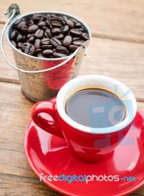 Red Cup Of Espresso On Wooden Table Stock Photo