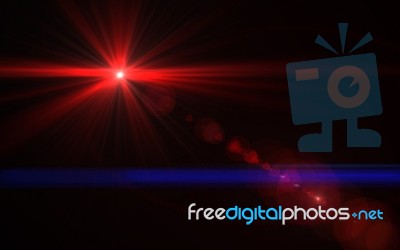 Red Digital Lens Flare In Black Background Horizontal Stock Image