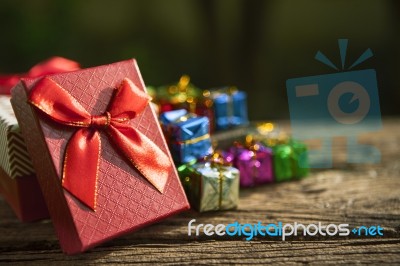 Red Gift Box On Old  Wood Floor  For Multipurpose Gift Festival Stock Photo