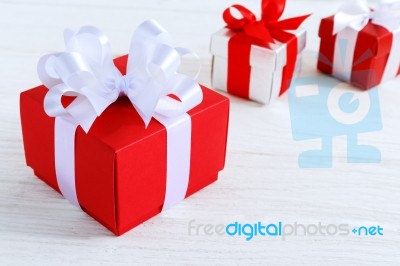 Red Gift Box With White Ribbon Stock Photo